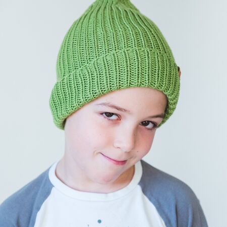 funny cute kid in knitted hatの写真素材