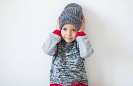 funny cute kid in knitted hatの写真素材