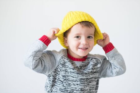 funny cute kid in knitted hatの写真素材