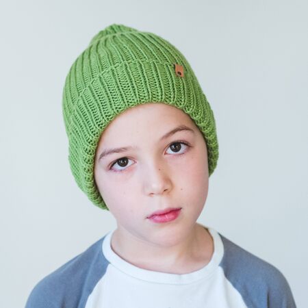 funny cute kid in knitted hatの写真素材