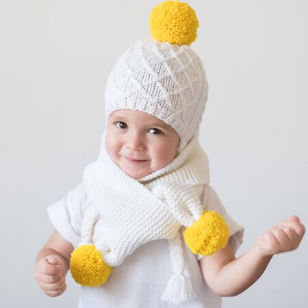 funny cute kid in knitted hatの写真素材