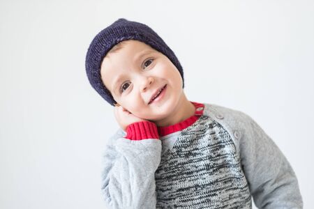 funny cute kid in knitted hatの写真素材