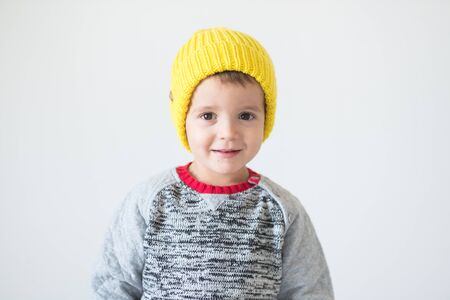 funny cute kid in knitted hatの写真素材