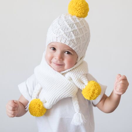 funny cute kid in knitted hatの写真素材