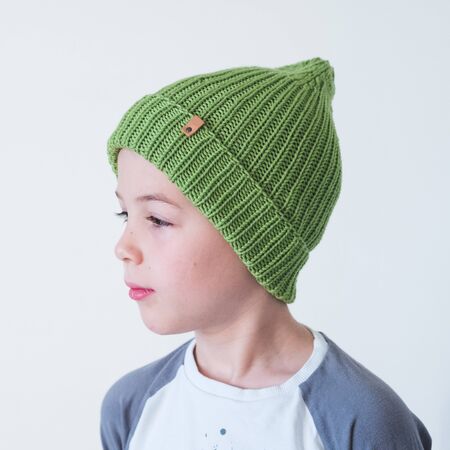 funny cute kid in knitted hatの写真素材
