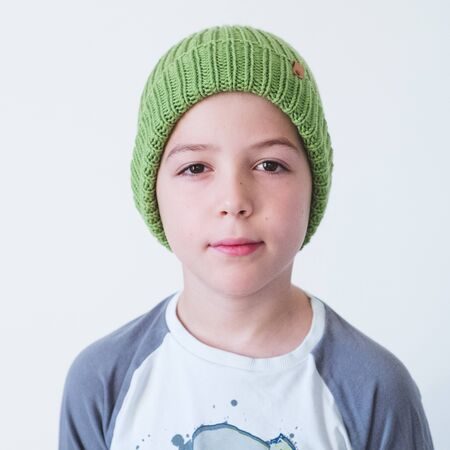funny cute kid in knitted hatの写真素材