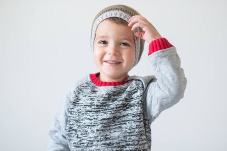 funny cute kid in knitted hatの写真素材