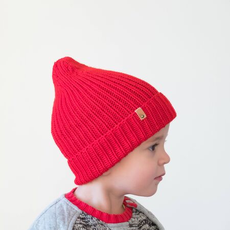 funny cute kid in knitted hatの写真素材