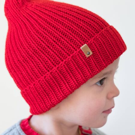 funny cute kid in knitted hatの写真素材