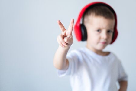 Fun young child enjoying rhythms in listening to music on headphonesの写真素材