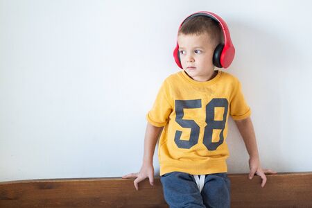 Young boy listening to music on headphonesの写真素材