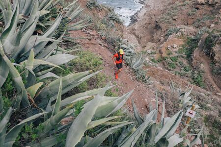 Trail runner run on the Tenerife Island. Sport running woman in cross country trail run.の写真素材