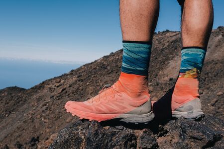 Successful runner hiker enjoy the view on mountain top cliff edge. Tenerife, Spainの写真素材