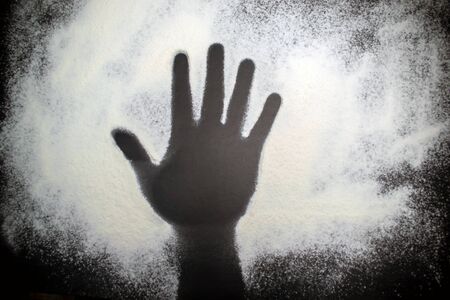 Background black footprint hands on a white textureの写真素材