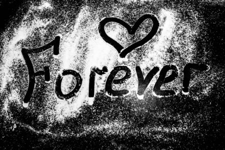 Lettering forever and heart on a white backgroundの写真素材