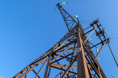 High voltage post against the skyの写真素材
