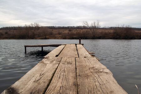 Wooden masonry on the banks of the riverの写真素材