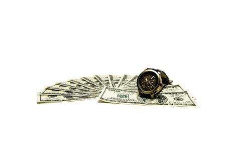 Wristwatch on dollars on a white backgroundの写真素材