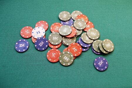 Poker chips on a green backgroundの写真素材