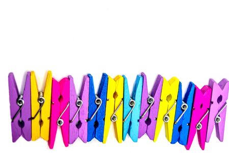 Colorful clothespins on a white background