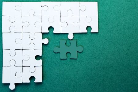 White puzzles on a green backgroundの写真素材