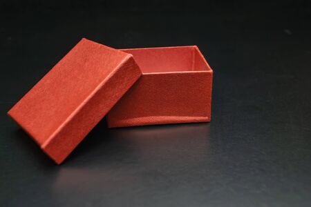Red open box on a black backgroundの写真素材