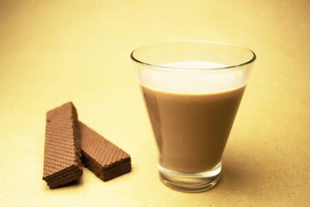Cocoa milk and two chocolate wafflesの写真素材