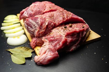 Fresh juicy meat on a cutting boardの写真素材
