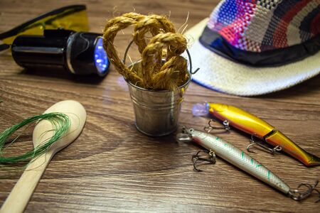 Fishing tackle on a wooden backgroundの写真素材