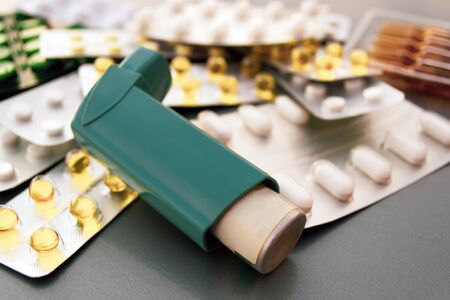 Pills, capsules, vaccine syringe medicines on gray backgroundの写真素材