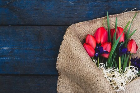 Bouquet tulip on a wooden table close-up