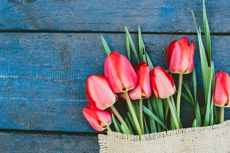 Bouquet tulip on a wooden table close-up