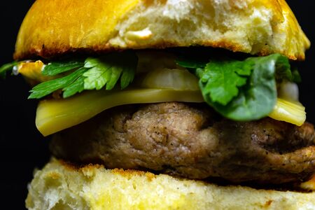Hamburger on a black background, junk foodの写真素材