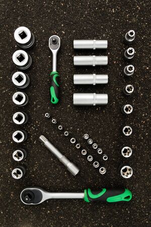 A set of tools, a complete set a six-sided key, a bit, a wrench. cardan joint, screwdriver-holder...