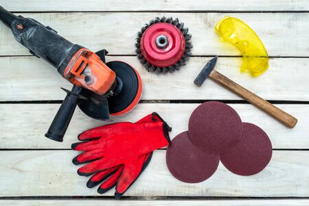 Wood background on which sanding tools are laid outの写真素材
