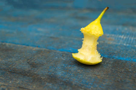 Pear stub. Blue background. Garbage close upの写真素材