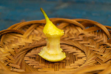 Pear stub. Blue background. Garbage close upの写真素材