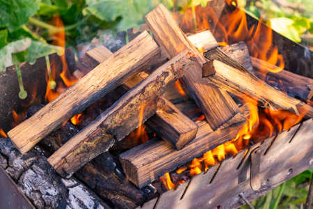 A fire is lit in the grill for cookingの写真素材