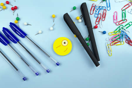 School supplies on a blue background. View from above.