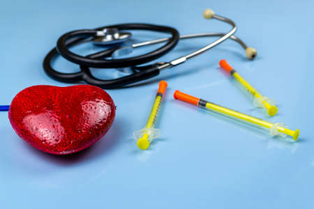 Stethoscope and insulin syringes, world diabetes day conceptの写真素材