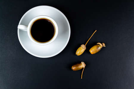 Cup of coffee, on a black background. Autumn concept