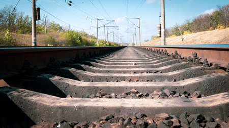 Railroad tracks in autumn close up. Travel concept