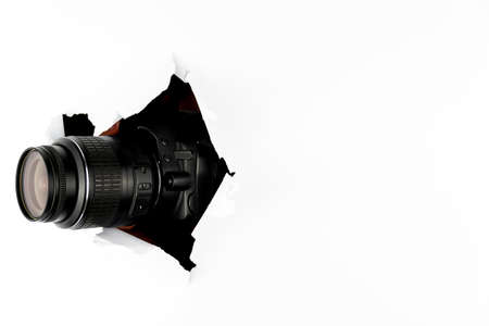 The camera pans through the torn white paper. The paparazzi are secretly watching. Free space for textの写真素材