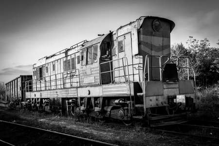 Locomotive on flights. Close-up of a train, black and white photo.
