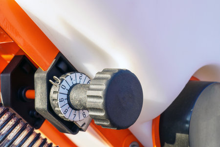 Close-up - Seed meter switch of an agricultural seeder. Structural parts of agricultural machinery