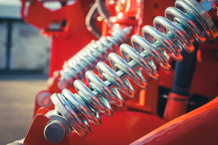 Agricultural machinery. Close-up of technical units and mechanisms of agricultural machinery. Springs and suspension elementsの写真素材