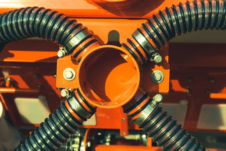 Common entrance for connecting corrugated pipes of an agricultural seeder. Structural details of agricultural machineryの写真素材