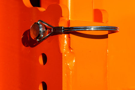 A close-up of a cotter pin for an agricultural seeder. Structural details of agricultural machinery