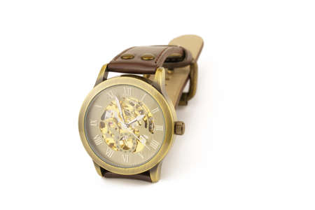 Mechanical wrist watch with brown strap on white background