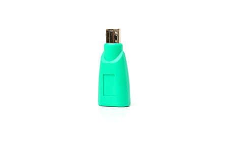 Adapter to ps 2 connector for USB isolated on white background. Close-up of green adapter